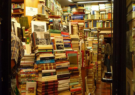 Stacks of books in a bookstore.